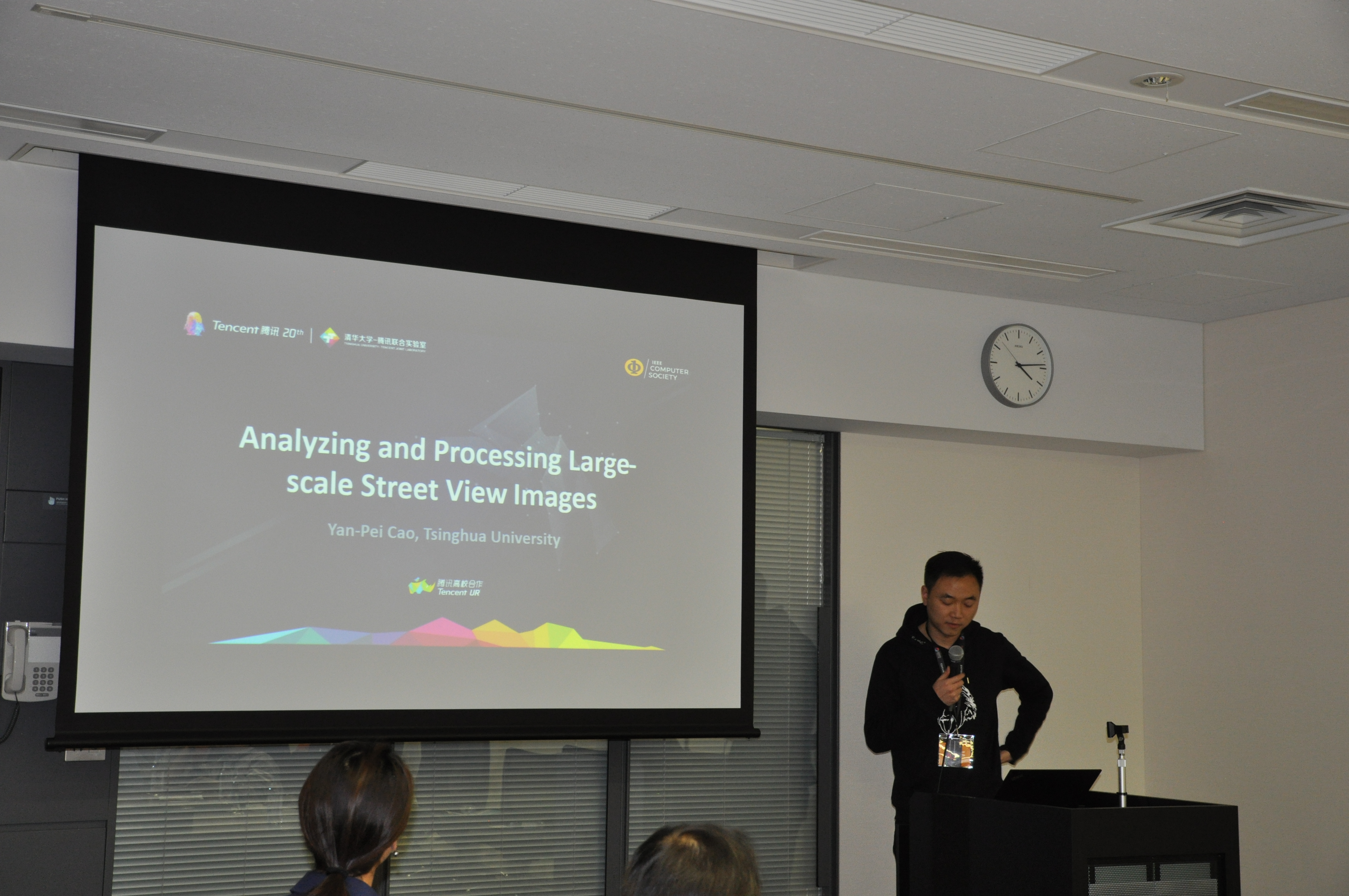 Researcher Yan-Pei Cao of Tsinghua University gives a presentation about "Analyzing and Processing Large-scale Street View Images" at a gathering between Tencent and IEEE Computer Society officials at Waseda University in Japan.