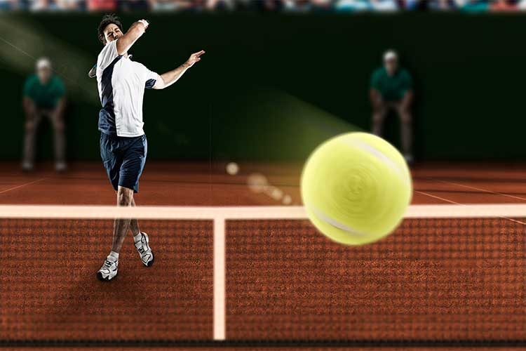 tennis player hitting ball directly at you