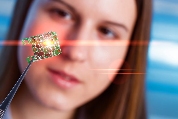 Woman looking at microchip