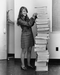 Margaret Hamilton, lead software engineer of the Apollo Project, stands next to a huge stack of code written by her and her team, in 1969.
